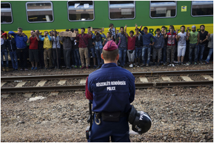 File source: https://commons.wikimedia.org/wiki/File:Syrian_refugees_strike_at_the_platform_of_Budapest_Keleti_railway_station._Refugee_crisis._Budapest,_Hungary,_Central_Europe,_4_September_2015._(3).jpg